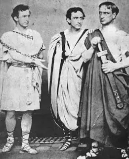 John Wilkes Booth (left) performing with his brothers