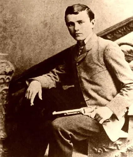 Robert Ford posing with the gun that killed Jesse James, circa 1882-1892